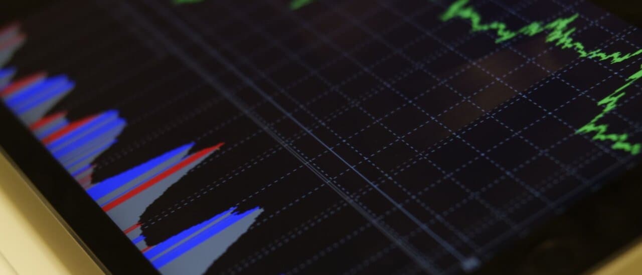 Close-up of trading charts displayed on a tablet screen