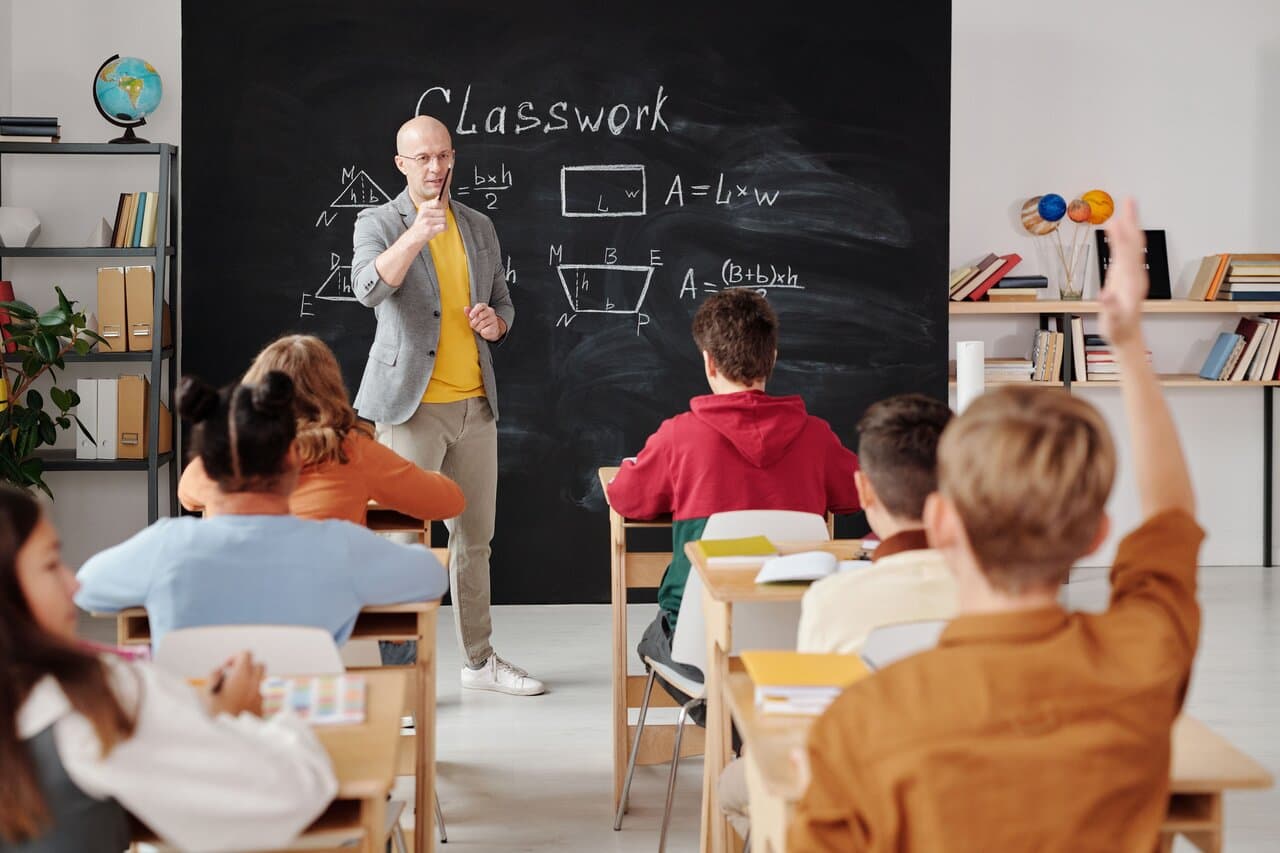 Teacher leading class with students in a modern classroom