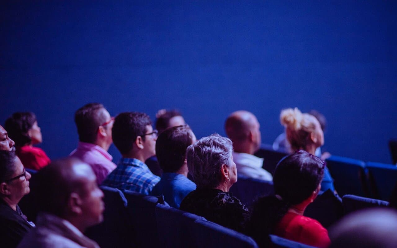 Audience seated at a live performance venue