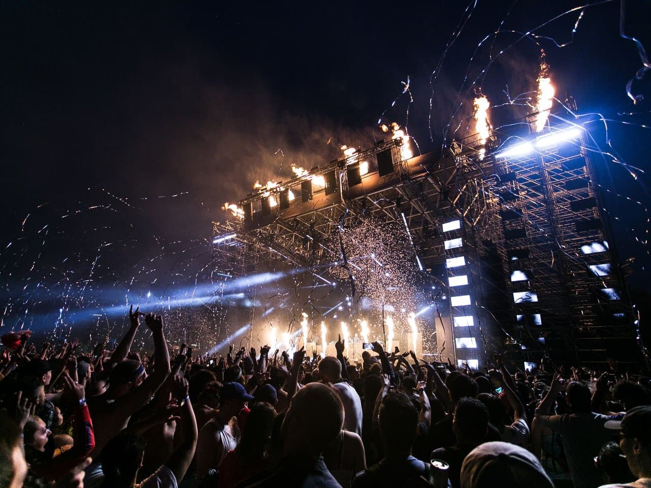 Audience enjoying a live concert with stage lights